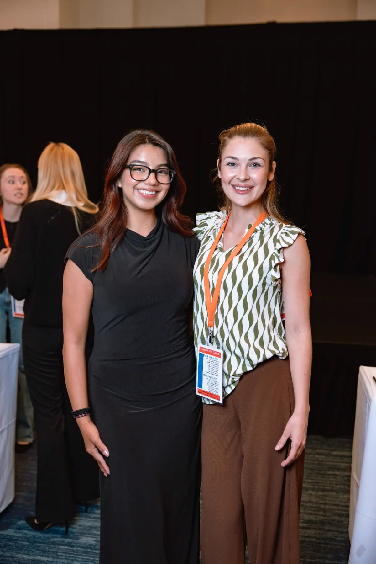 Two team members at the annual firm conference